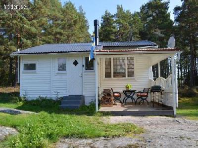 Cottage with boat and canoe